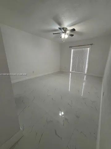 en empty room with fan