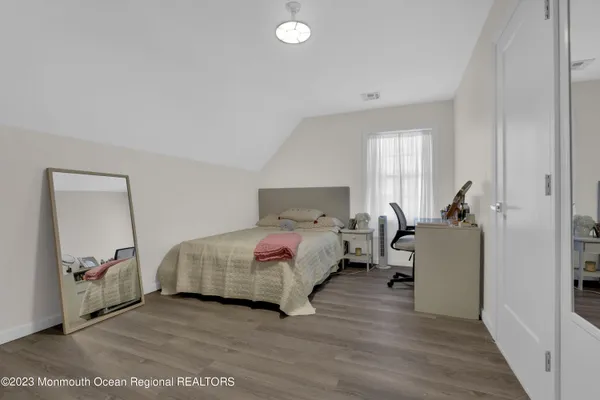 a bed room with a bed and a window