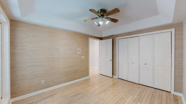 a bathroom with a tub a sink a mirror and a shower
