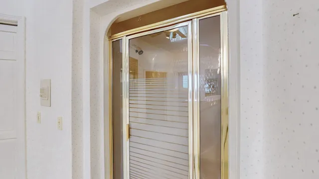 a view of a livingroom with furniture and a window