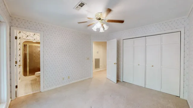 a view of a house with a tree in the background