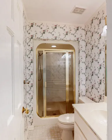 a view of a balcony with wooden floor and lake view