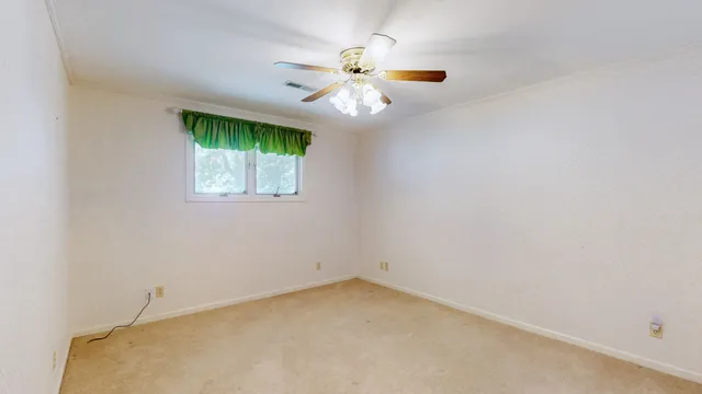 a view of a chair and table on the wooden floor