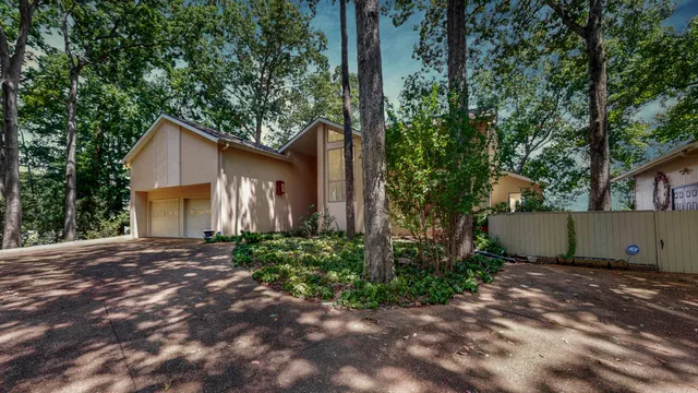 a large kitchen with a sink and cabinets