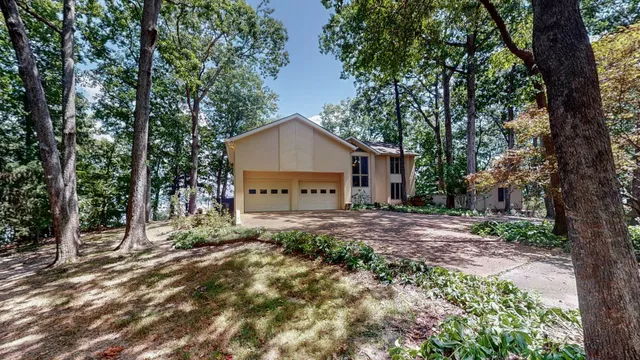 an aerial view of a houses with ocean view