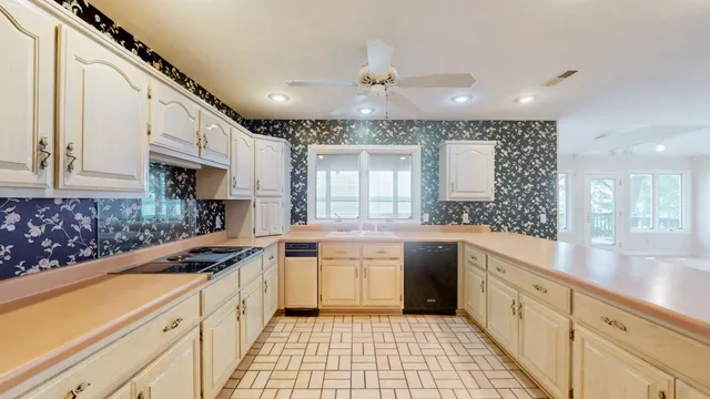 a view of staircase with white walls and a window