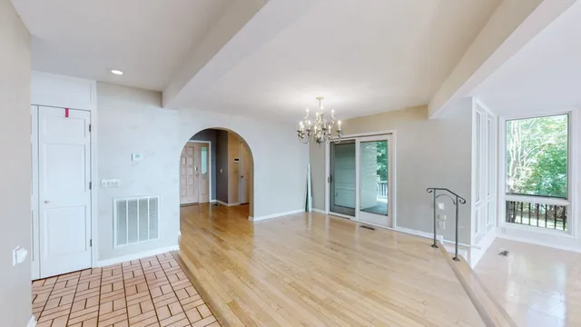 a kitchen with granite countertop a refrigerator and a stove top oven