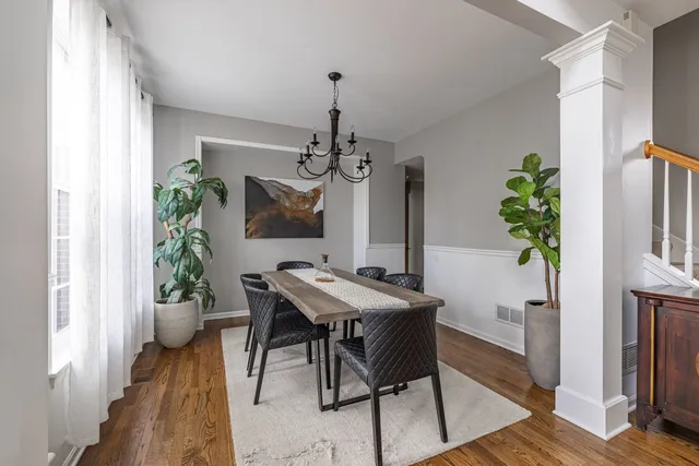 a view of a dining room with furniture window and wooden floor