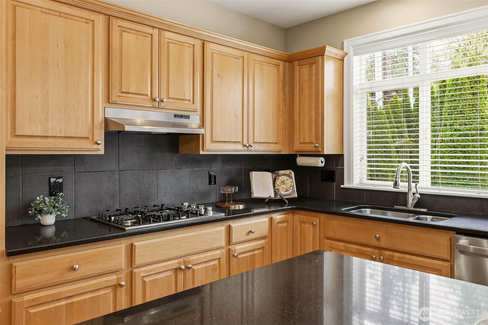 3501 156th Place Southeast Bothell, WA 98012 - Photo 13 of 36 a kitchen with granite countertop a sink a stove and cabinets