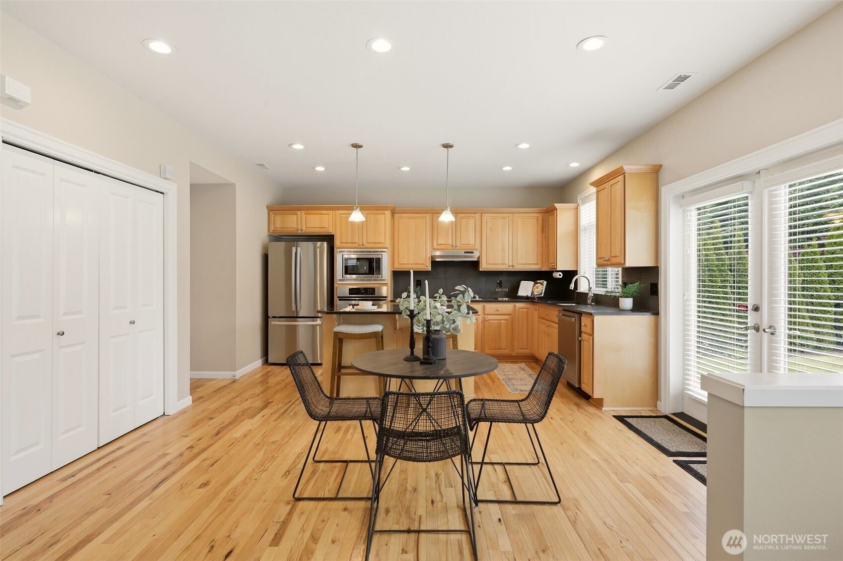 3501 156th Place Southeast Bothell, WA 98012 - Photo 17 of 36 a view of a dining room with furniture and wooden floor
