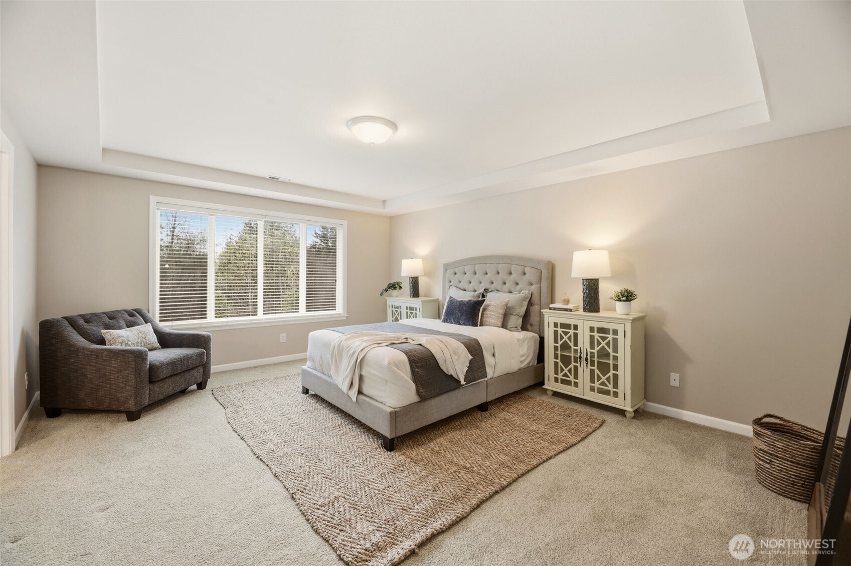 3501 156th Place Southeast Bothell, WA 98012 - Photo 19 of 36 a spacious bedroom with a bed and a couch