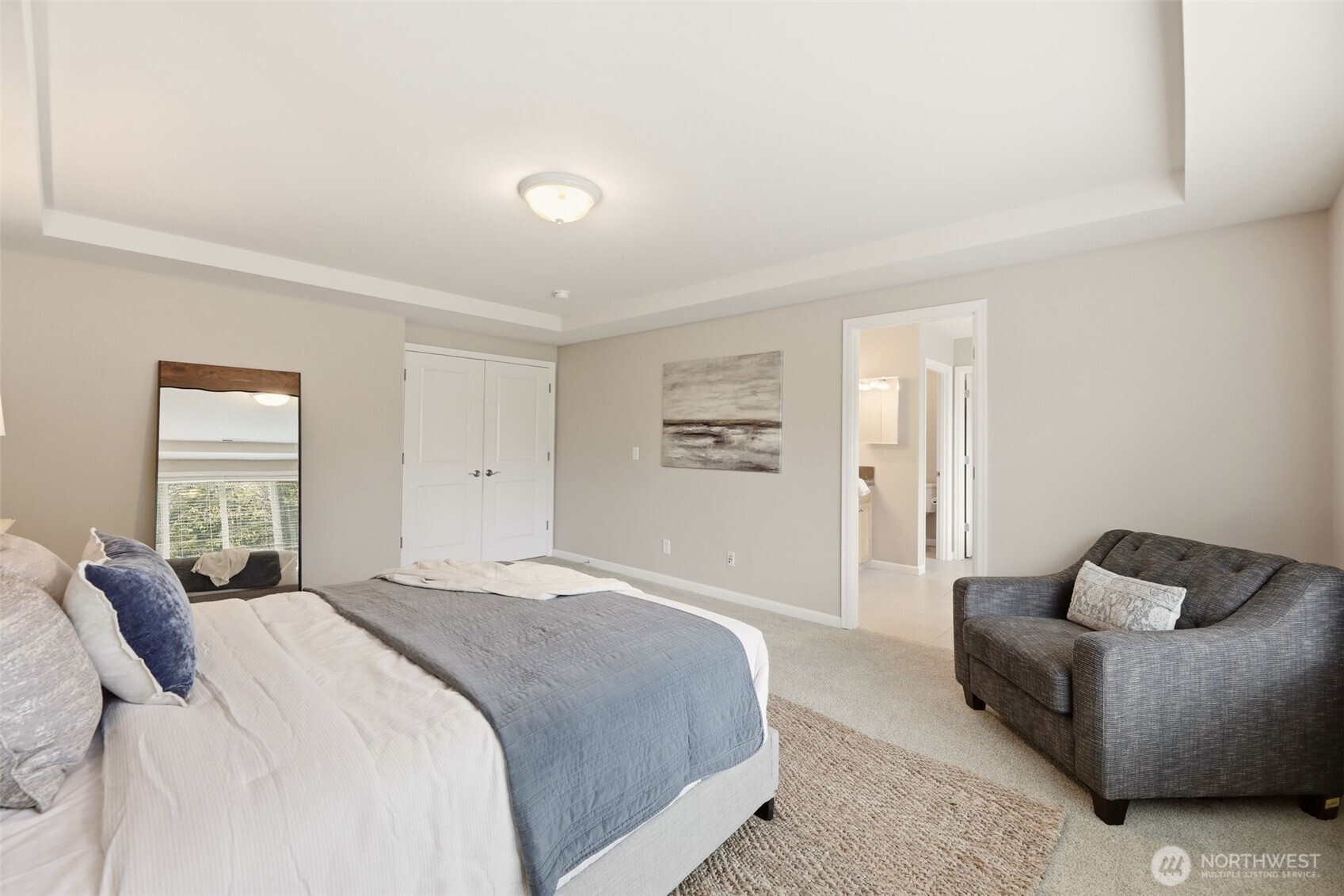 3501 156th Place Southeast Bothell, WA 98012 - Photo 20 of 36 a spacious bedroom with a bed and window