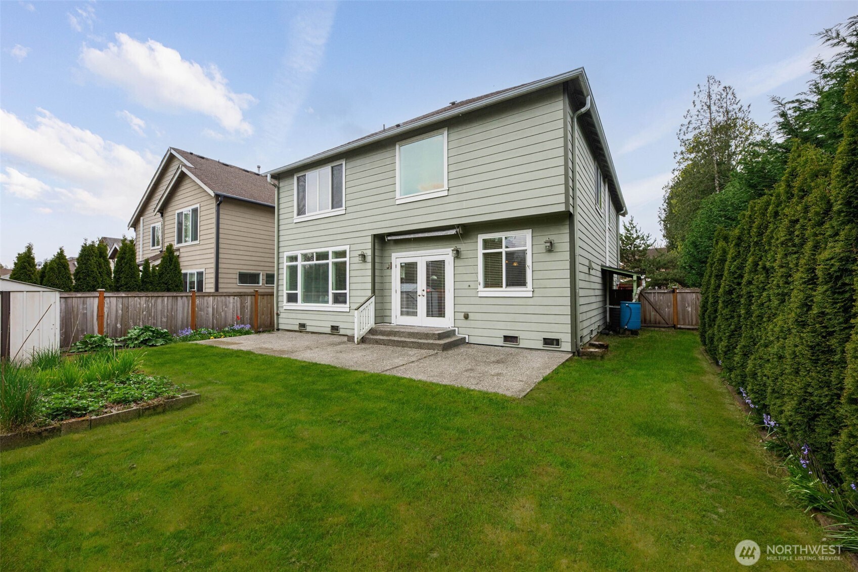 3501 156th Place Southeast Bothell, WA 98012 - Photo 32 of 36 a front view of a house with a garden and porch