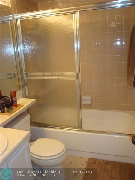 Coral Gate Margate, FL 33063 - Photo 12 of 28 a bathroom with a toilet and a shower