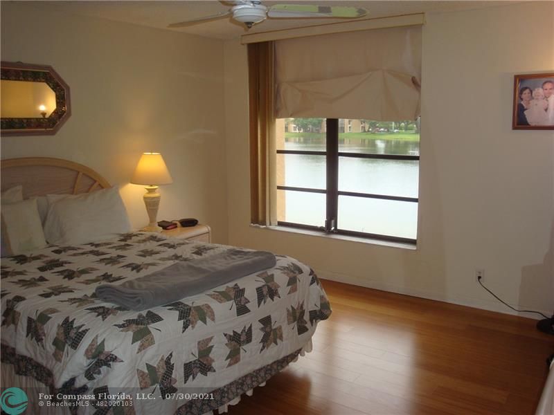 Coral Gate Margate, FL 33063 - Photo 15 of 28 a bedroom with a bed and a window