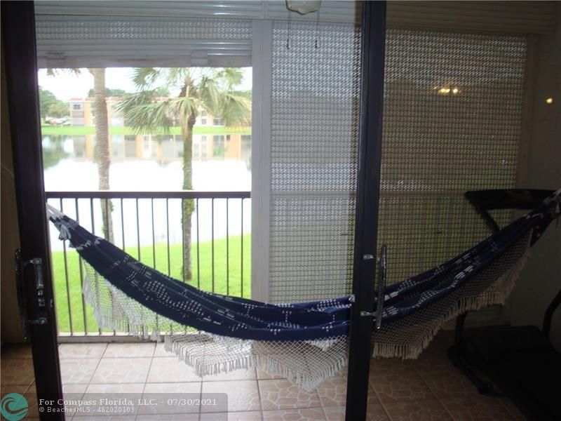Coral Gate Margate, FL 33063 - Photo 20 of 28 a view of balcony with a potted plant