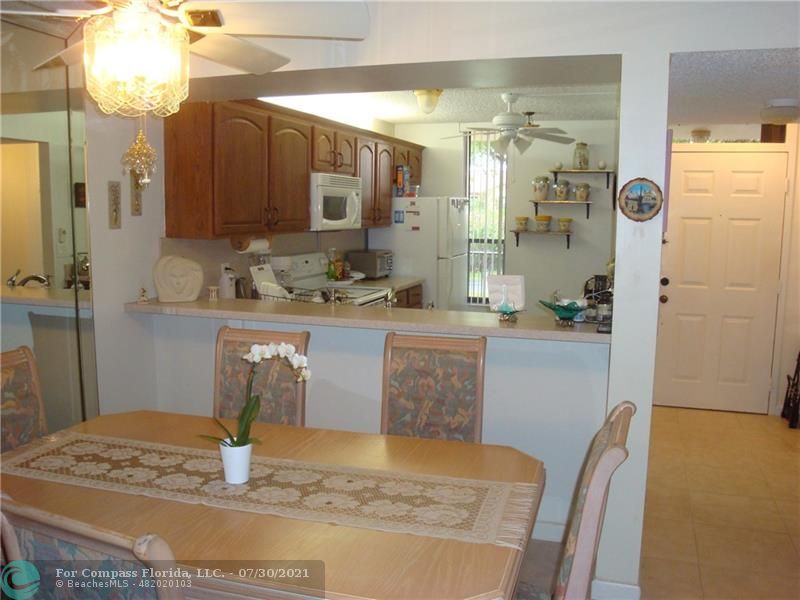 Coral Gate Margate, FL 33063 - Photo 3 of 28 a dining room with a table and chairs