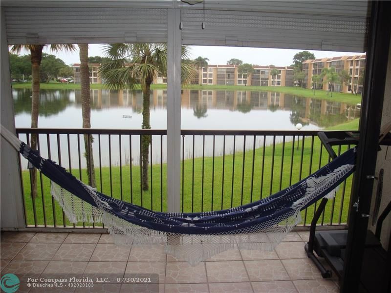 Coral Gate Margate, FL 33063 - Photo 21 of 28 a view of balcony with a potted plant