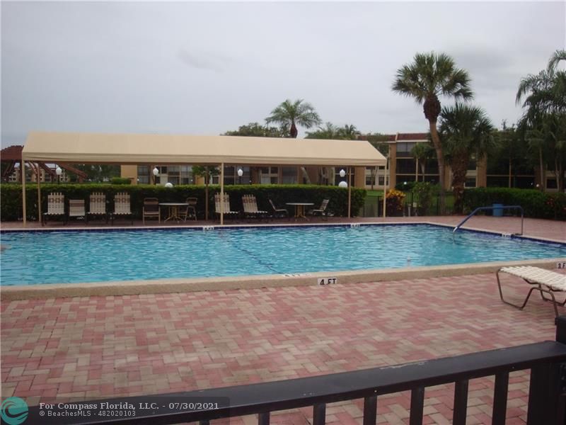 Coral Gate Margate, FL 33063 - Photo 27 of 28 a view of a house with a yard