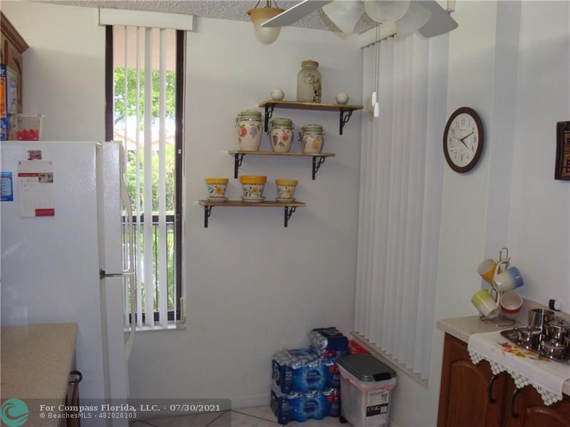 Coral Gate Margate, FL 33063 - Photo 6 of 28 a room with a small closet and a window