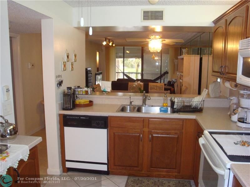 Coral Gate Margate, FL 33063 - Photo 7 of 28 a bathroom with a double vanity sink and a mirror
