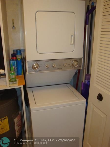 Coral Gate Margate, FL 33063 - Photo 8 of 28 a utility room with dryer and washer