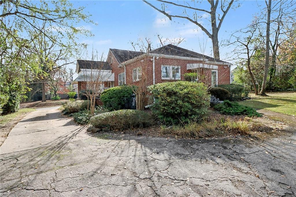 109 Stockbridge Road Jonesboro, GA 30236 - Photo 16 of 16 a front view of a house with a garden