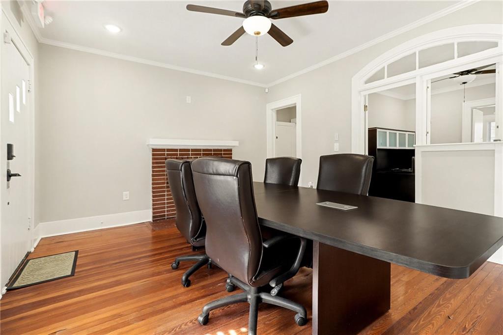 109 Stockbridge Road Jonesboro, GA 30236 - Photo 3 of 16 a view of a workspace with furniture and wooden floor