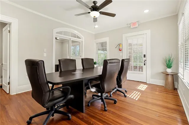 a view of a dining room with furniture window and wooden floor