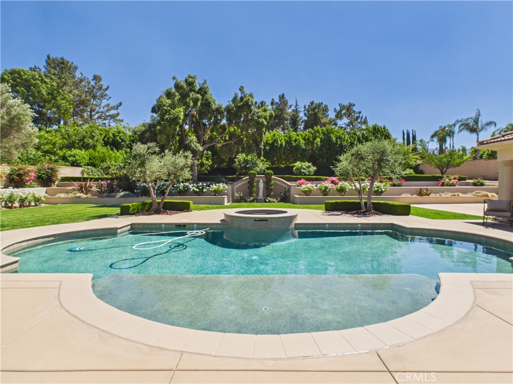 1662 Cherokee Road Corona, CA 92881 - Photo 38 of 60 a view of a swimming pool with a yard and plants