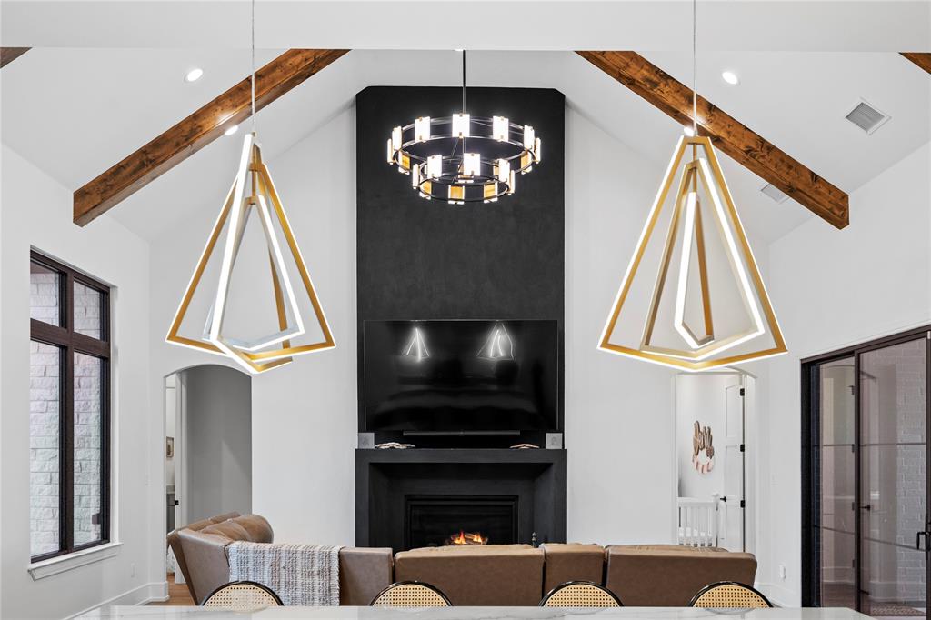 2804 Buchanan Road Hallsville, TX 75650 - Photo 12 of 40 a living room with furniture a flat screen tv and a fireplace