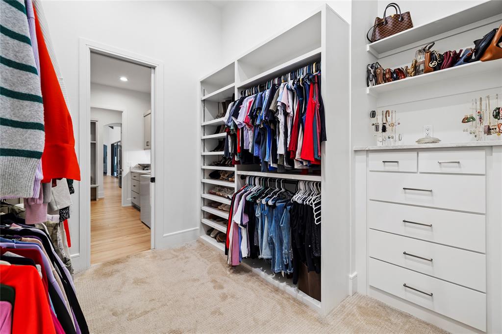 2804 Buchanan Road Hallsville, TX 75650 - Photo 18 of 40 a view of walk in closet with clothes and shoes