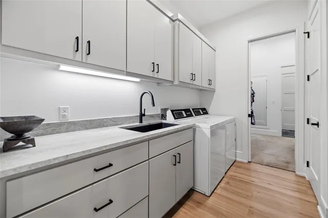a kitchen with a sink and cabinets