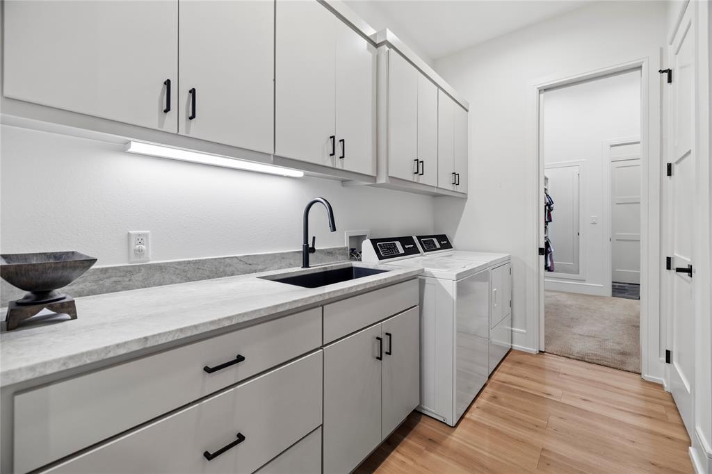 2804 Buchanan Road Hallsville, TX 75650 - Photo 22 of 40 a kitchen with a sink and cabinets