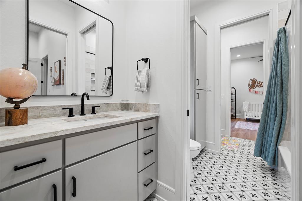 2804 Buchanan Road Hallsville, TX 75650 - Photo 25 of 40 a bathroom with a sink a toilet and a mirror