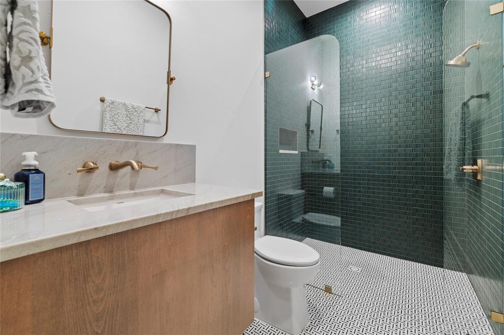 2804 Buchanan Road Hallsville, TX 75650 - Photo 31 of 40 a bathroom with a sink a toilet and shower