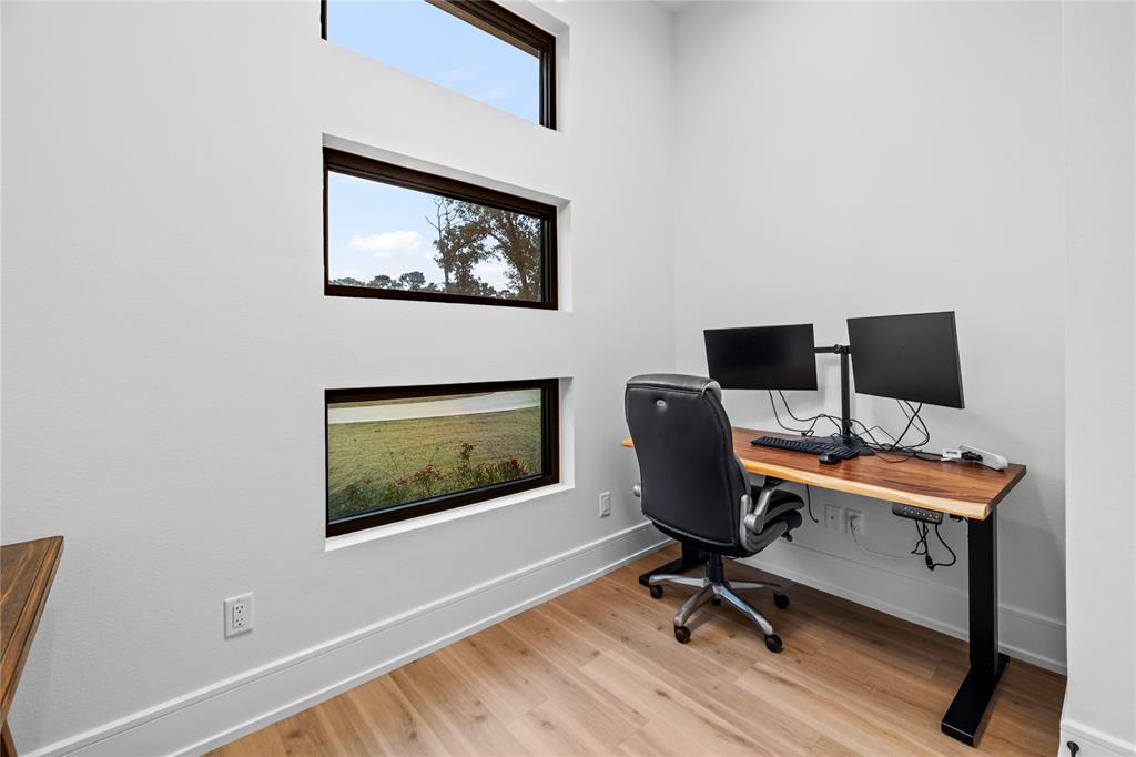 2804 Buchanan Road Hallsville, TX 75650 - Photo 33 of 40 a view of a workspace with furniture and a window