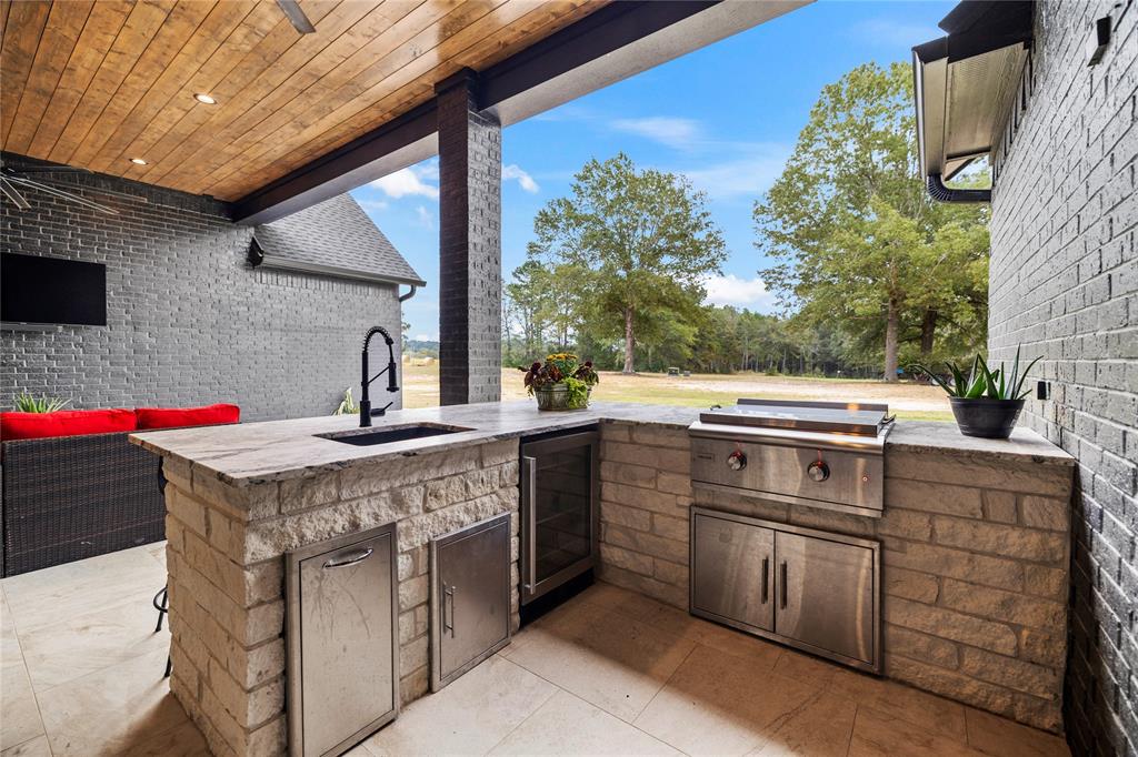 2804 Buchanan Road Hallsville, TX 75650 - Photo 36 of 40 a kitchen with a stove and a microwave