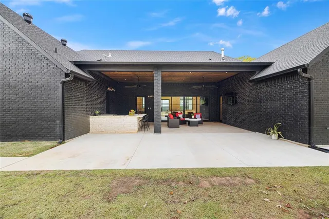 a view of a patio with table and chairs