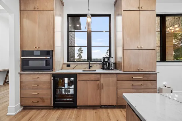 a kitchen with stainless steel appliances granite countertop a stove and a sink
