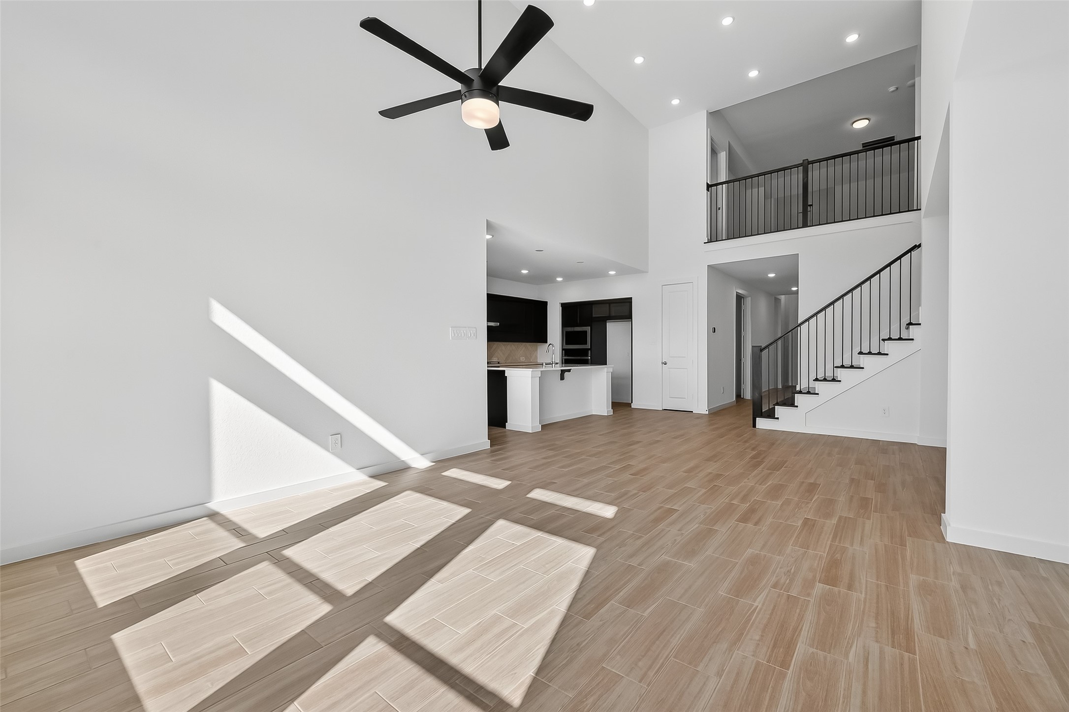 3222 Kindred Way Richmond, TX 77406 - Photo 13 of 50 wooden floor in an empty room with a window