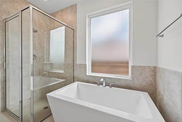 a bathroom with a bathtub and a sink