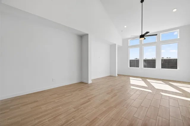 a view of an empty room with windows