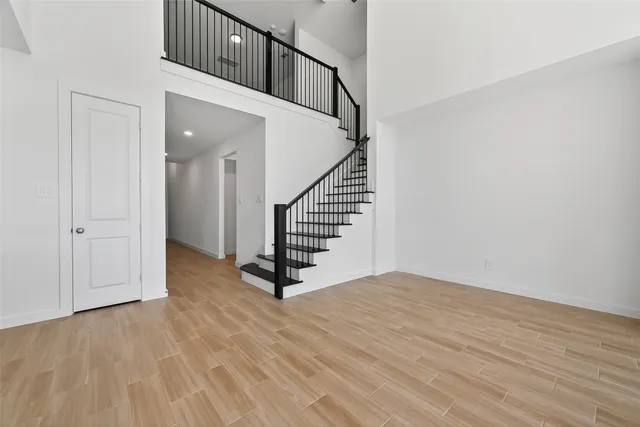 a view of an entryway with wooden floor