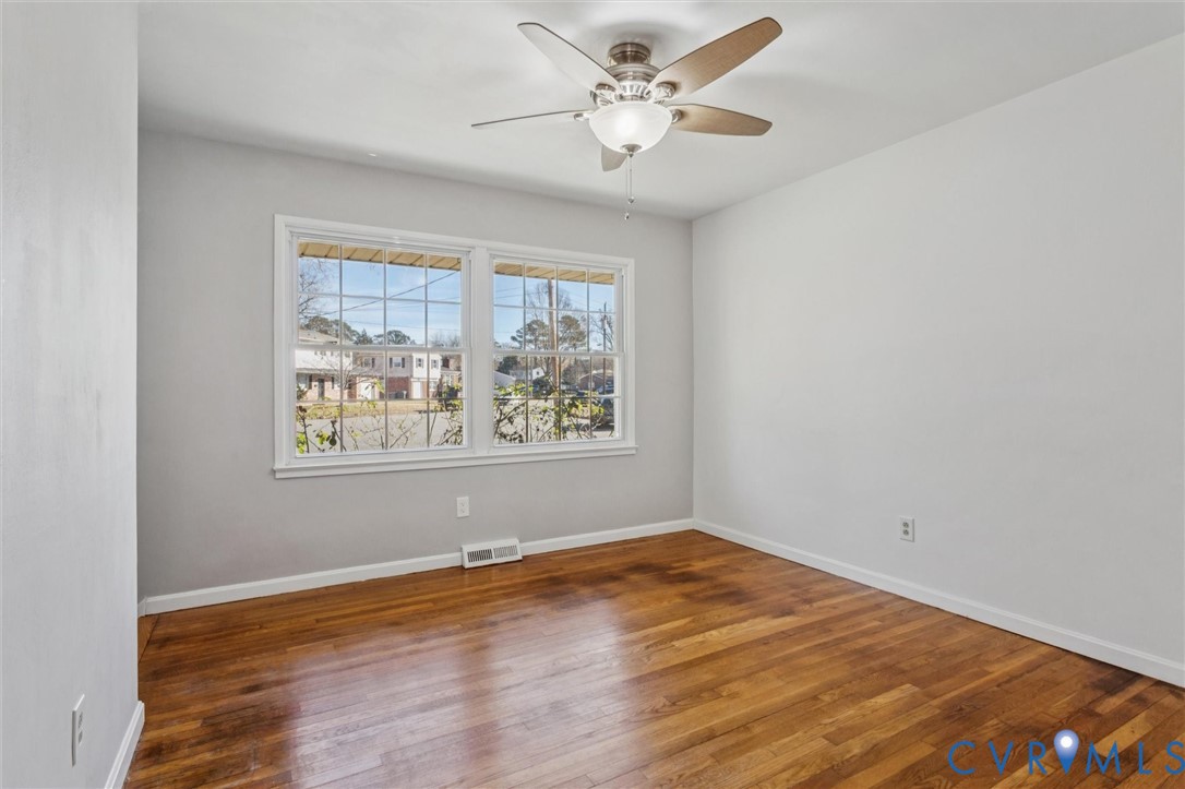 4 Michele Drive Hampton, VA 23669 - Photo 11 of 36 a view of a big room with wooden floor and windows