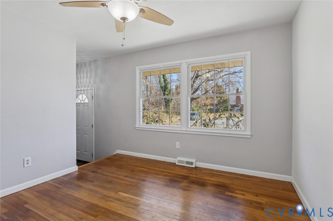 4 Michele Drive Hampton, VA 23669 - Photo 13 of 36 a view of an empty room with wooden floor and a window