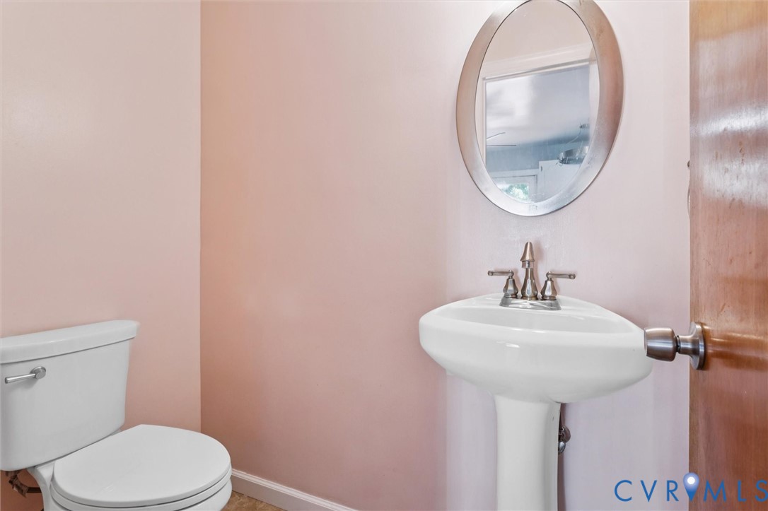 4 Michele Drive Hampton, VA 23669 - Photo 14 of 36 a bathroom with a sink a mirror and a toilet