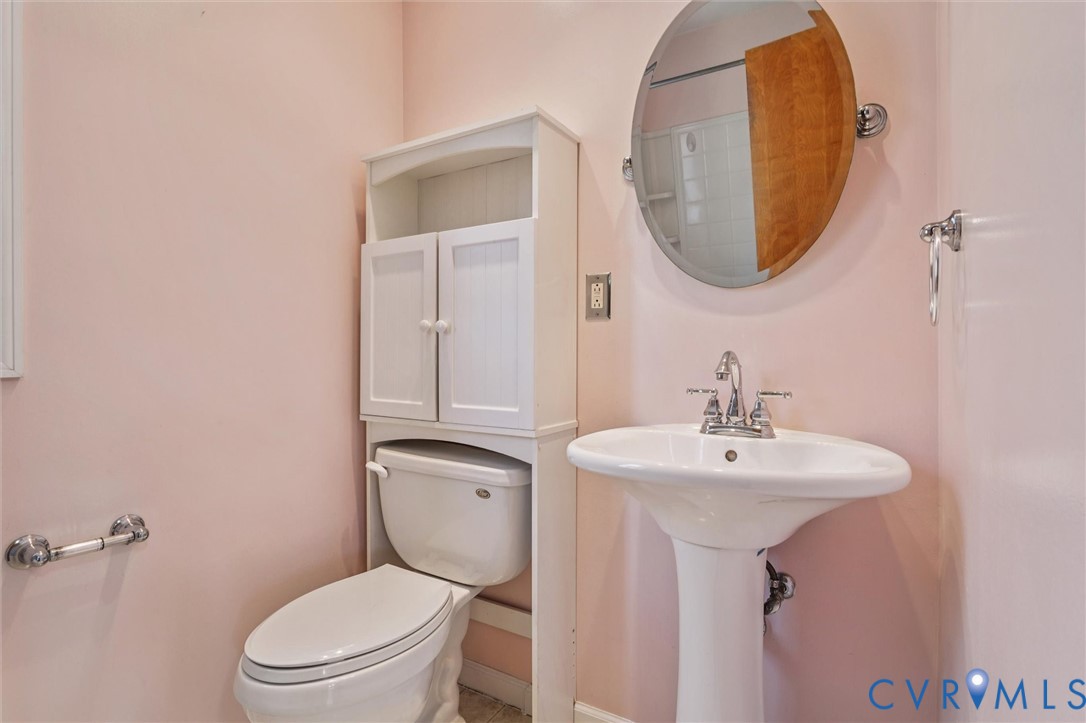 4 Michele Drive Hampton, VA 23669 - Photo 15 of 36 a bathroom with a toilet sink and mirror