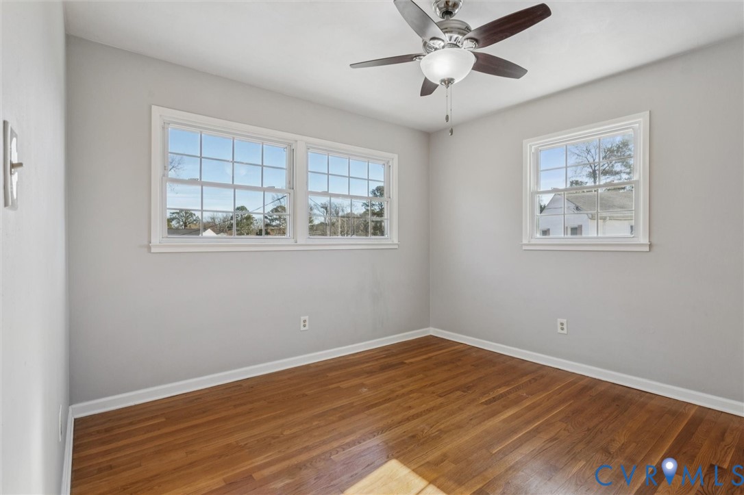 4 Michele Drive Hampton, VA 23669 - Photo 17 of 36 a view of an empty room with wooden floor and a window