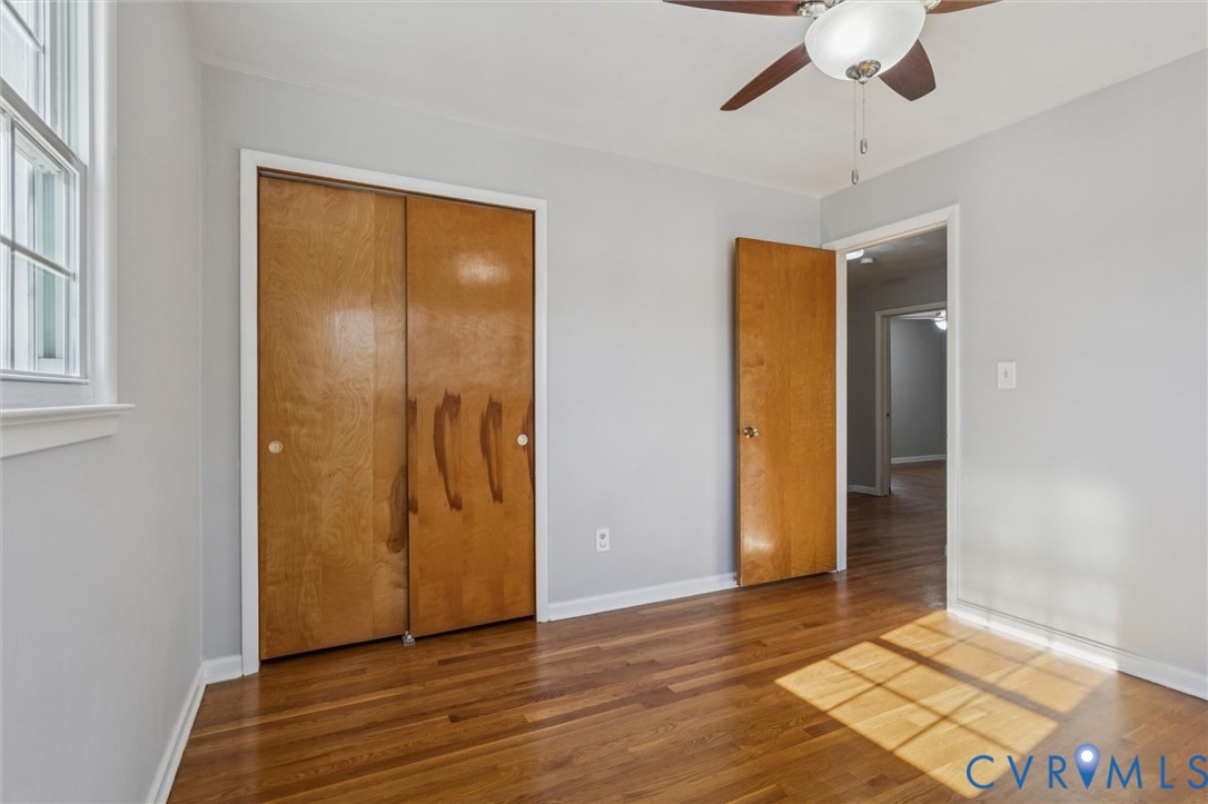 4 Michele Drive Hampton, VA 23669 - Photo 18 of 36 an empty room with wooden floor and a ceiling fan